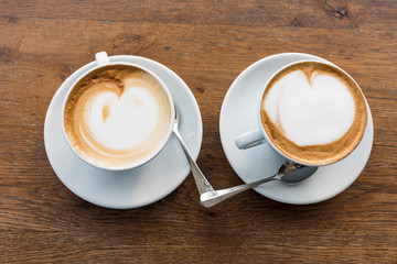 Pair of cappuccinos with heart