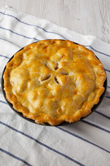 Homemade apple pie on cloth, low angle view. Close-up.