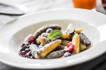 Potato dumplings sulance gnocci with milled poppy seeds shugar powder and marmalade. Traditional slovak czech and austrian sweet food