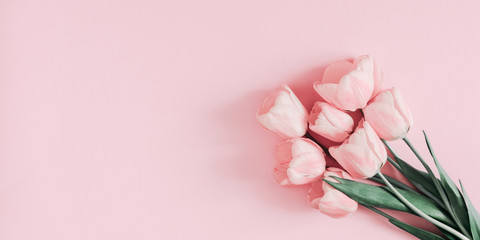 Beautiful composition spring flowers. Bouquet of pink tulips flowers on pastel pink background....