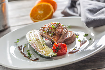 Roasted duck breast with zucchini tomato and parsley herbs