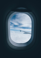 Airplane porthole window during flight