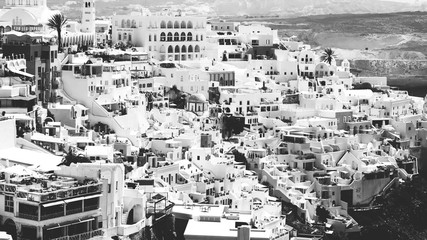 Fototapeta premium View of Oia or Ia village in the South Aegean on the islands of Thira Santorini and Therasia, in the Cyclades, Greece. black and white.