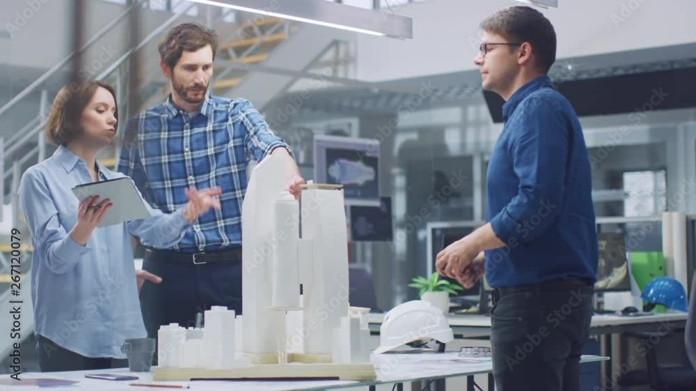 Poster in architectural bureau: team of architects and engineers working on a building complex prototype pr