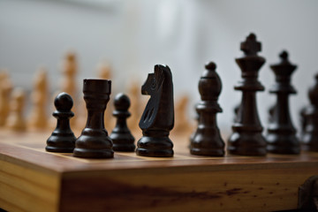 Starting point of a chess game, view from the corner on the black side.