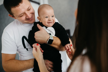 Portrait of a happy family with a little baby boy.