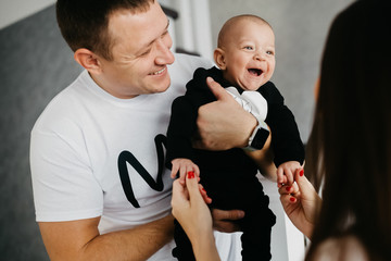 Portrait of a happy family with a little baby boy.