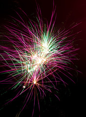 Beautiful sparks from fireworks in the sky at night