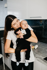 Portrait of a happy young mother with a little baby boy.