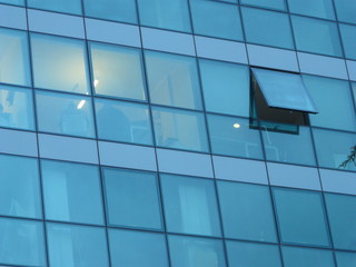 glass building facade in modern skyscraper and reflex