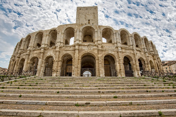 Fototapeta na wymiar Ancient Roman arena in Arles - Arenes d' Arles. A view of the Roman Amphitheater of Arles, Provence, Bouches-du-Rhône, France