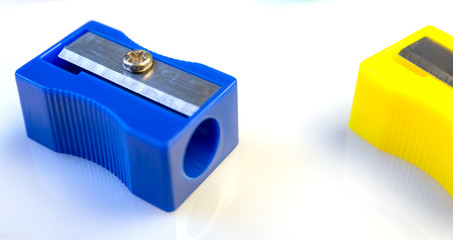 Large pencil sharpener on a white isolated background, close-up with space for the text.