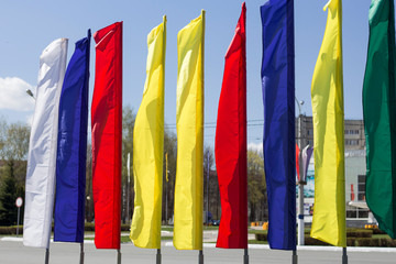 colored holiday flags on the Sunny streets of the city