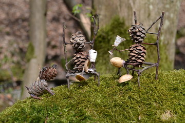 Forest figures relax in the spring sun with the dog