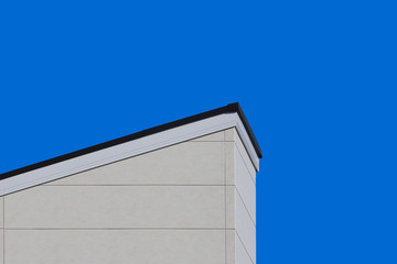 modern slope style design roof house wall with clear blue sky background.