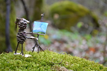 Forest figure paints spring landscape