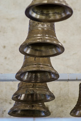 Fototapeta na wymiar antique bronze bells with inscription
