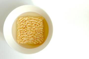 Instant noodle in white ceramic bowl