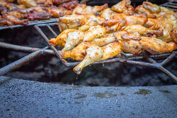 Chicken legs on the grill grill over the natural heat of a volcano in the El Diablo Canary Islands National Park. Spain Lanserote
