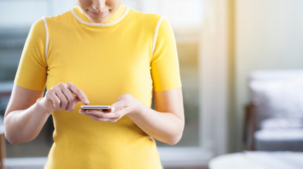 Lady hands touching a smart phone