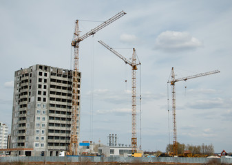 cranes in construction and building houses