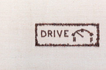 The word drive next to a fuel gauge in a rectangle made from coffee beans, aligned on the right.