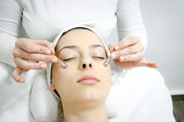 collagen treatment for area around the eyes with special sticks, procedure of regeneration and rejuvenation of the skin in beauty salon, close up