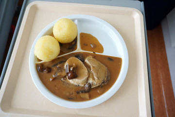 Hunter's roast with Klose and mushrooms in brown sauce served on the tray 
