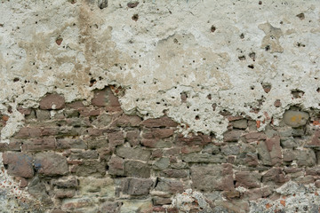 The  high resolution texture of the old brick wall with showered plaster and clay putty. Useful for the texture of the old castle or walls in design, architecture and game development