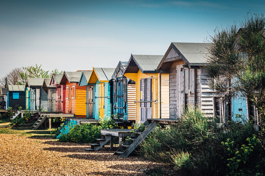 Colorful cabanas lining the beach in the Southeast English town of Whitstable. 
