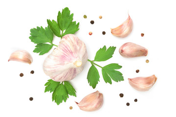 Mediterranean food ingredients - bulbs of garlic with parsley and pepper isolated on a white background