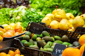 Vegetable stall on bazaar with colorful vegetables and fruits
