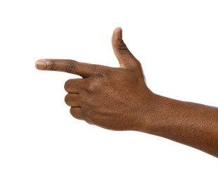 African-American man pointing at something on white background, closeup