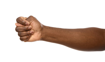 African-American man showing fig gesture on white background, closeup