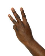 African-American man showing number THREE on white background, closeup