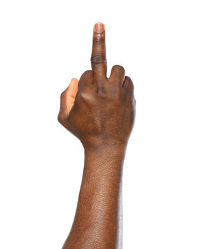 African-American man showing middle finger on white background, closeup