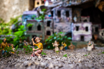figures of people on the background of the mock-up of the city