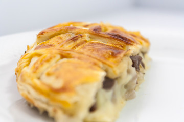 half a traditional English shepherd's pie (cut in half) on a white plate