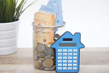 financial concept, calculator, coin and paper money