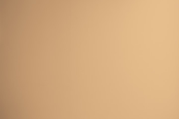 soft creme color texture background in light beige tone with vignette