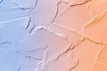 Fototapeta premium Abstract gradient texture, blue and orange plaster background, painted texture