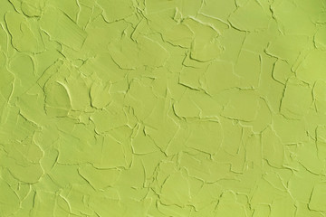 Green pistachio color, textured background, wavy plaster - 267140068