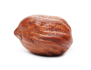 Peeled hazelnut isolated on white background, macro series