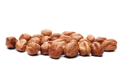 Peeled hazelnuts isolated on white background