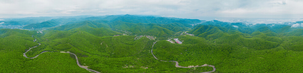 Fototapeta na wymiar Caucasus mountains and green forest panorama view