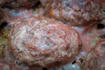 Meat cutlets cooked on a baking sheet in the oven