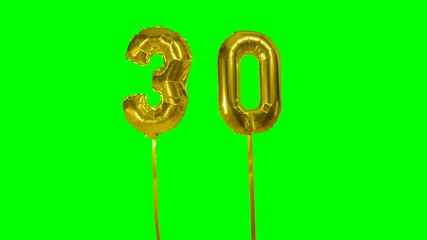 Number 30 thirty years birthday anniversary gold balloon floating on green screen