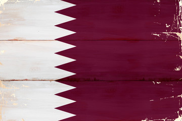 Flaga Kataru malowana na starej desce.