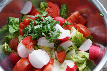 Fresh salad served in different variations in bowls on the tray