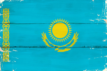 Flaga Kazachstanu malowana na starej desce. - obrazy, fototapety, plakaty